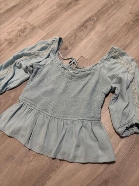 Light Blue Smocked Peplum Blouse with Lace-Trimmed Sleeves